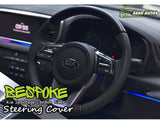 Carbon Fiber Bespoke Steering Cover for Kia Sportage, offering a premium fit and enhanced comfort, adding a sleek, sporty look to the vehicle's interior.