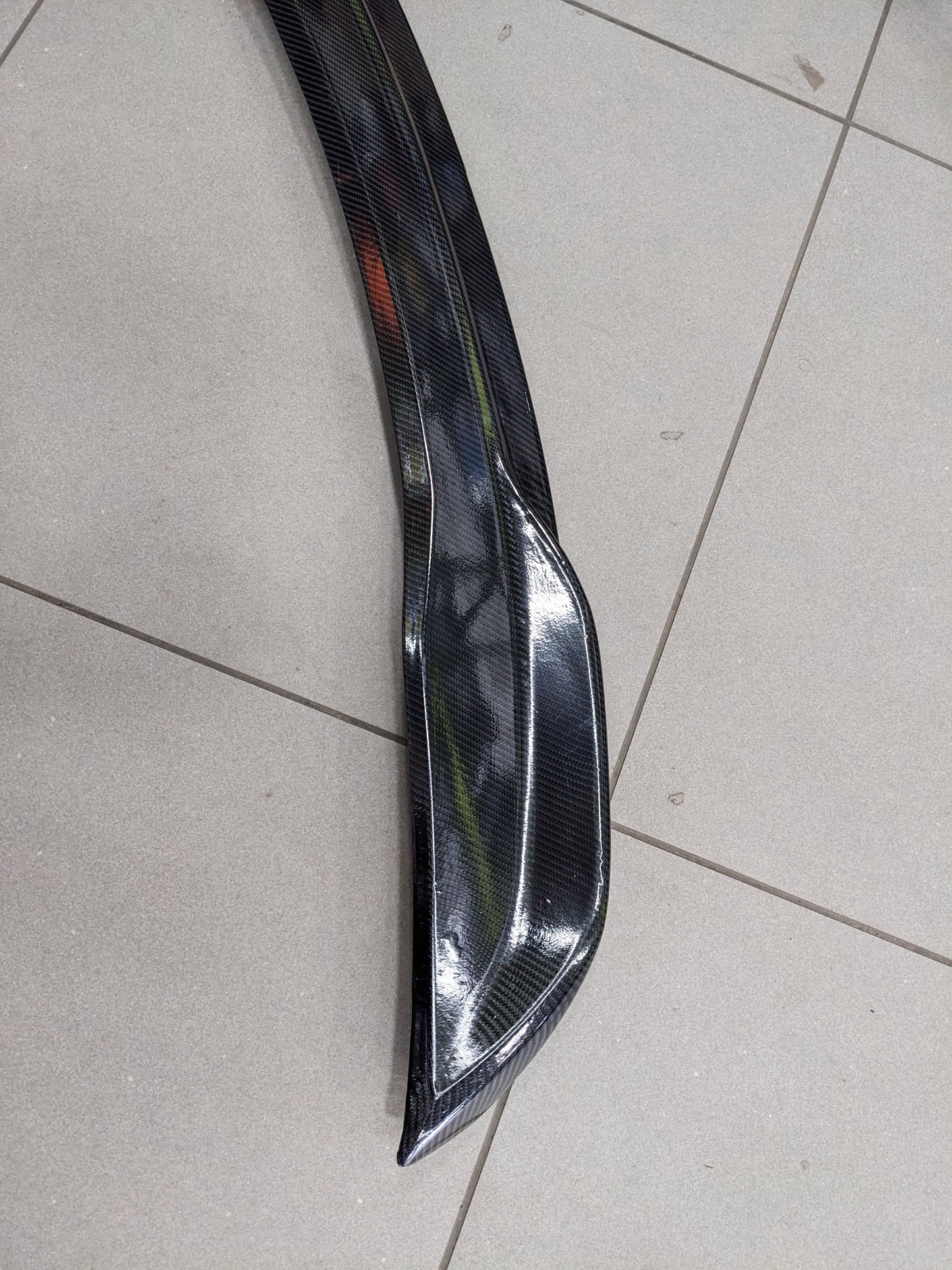 Honda Civic 2022-2025 Carbon Fiber Trunk Spoiler, featuring a sleek design, aerodynamic performance, and a lightweight yet durable build for a sporty appearance.