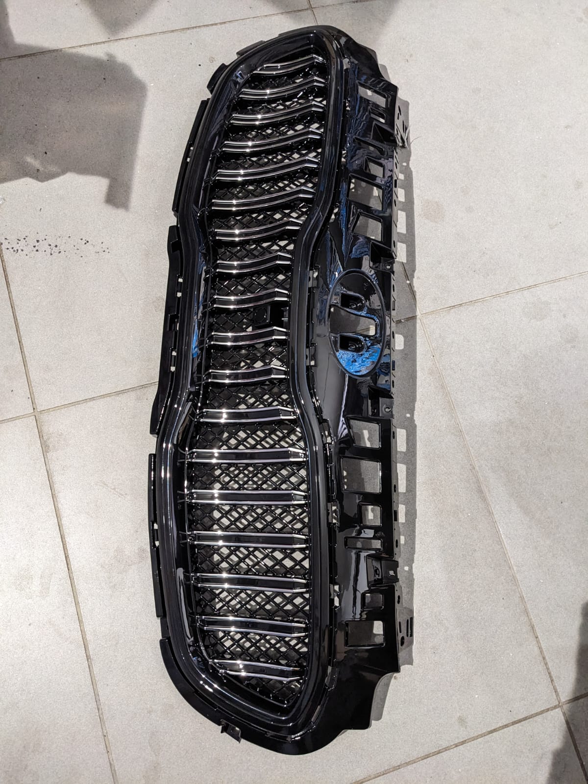 Kia Sportage glossy front grill, designed to add a sleek and premium touch to your vehicle’s front-end appearance.