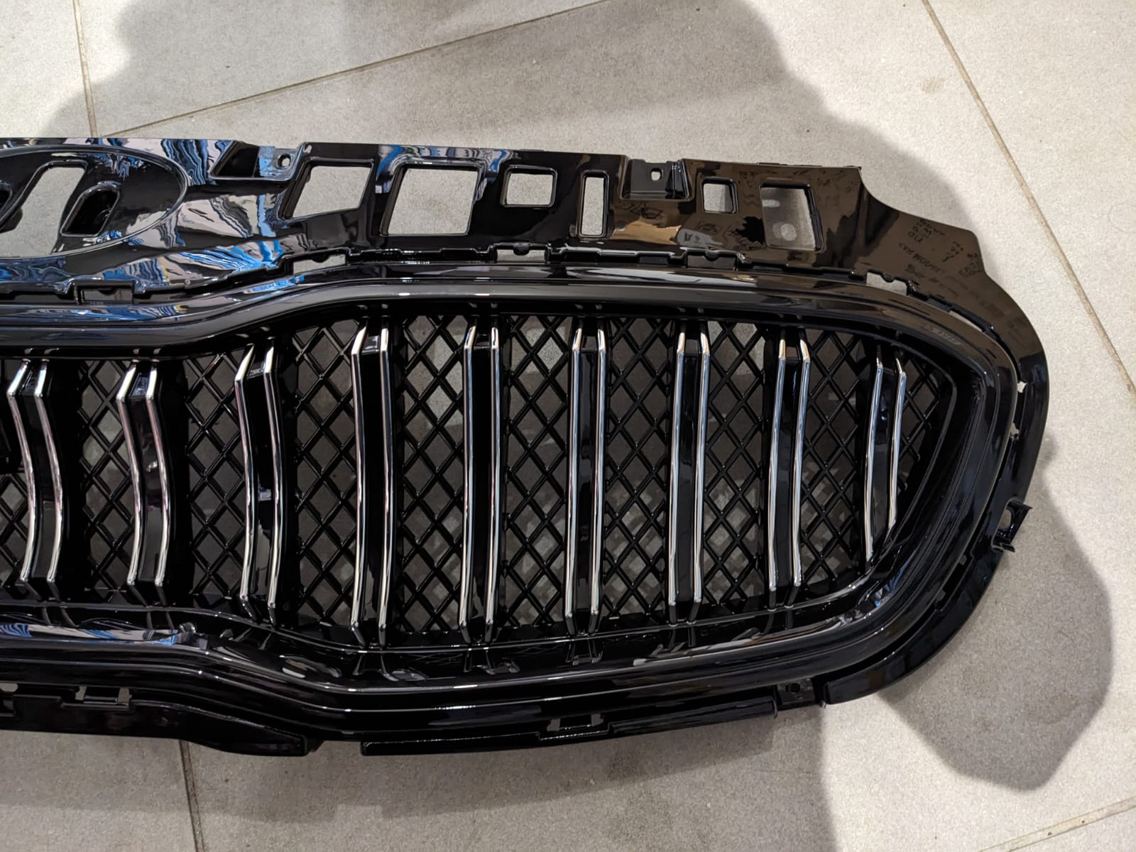 Kia Sportage glossy front grill, designed to add a sleek and premium touch to your vehicle’s front-end appearance.