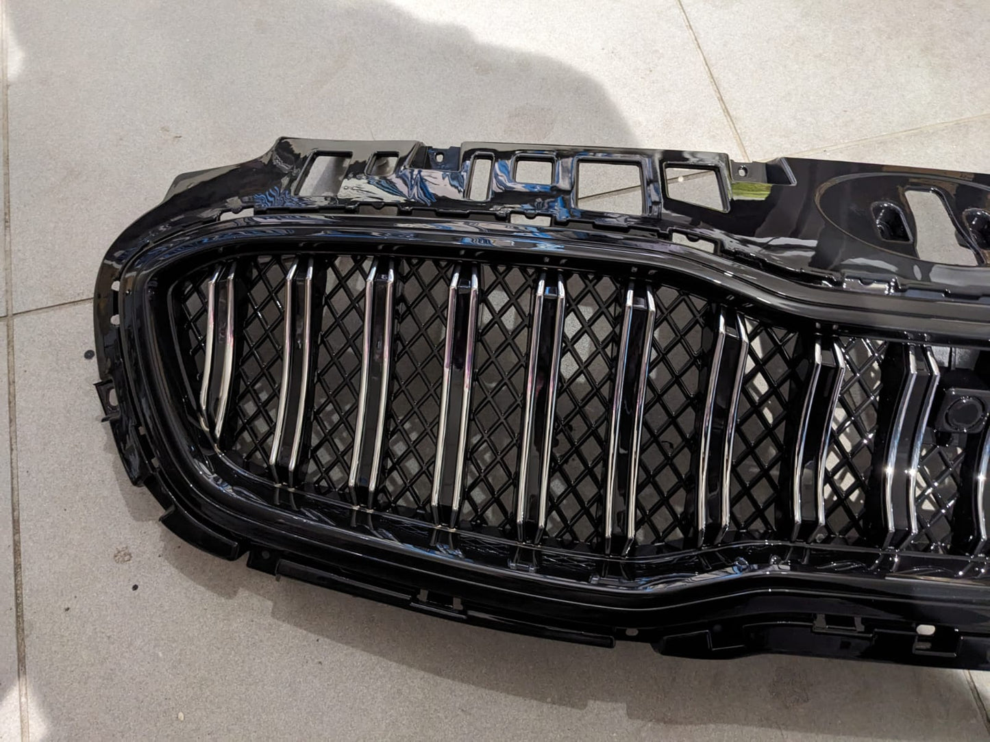 Kia Sportage glossy front grill, designed to add a sleek and premium touch to your vehicle’s front-end appearance.
