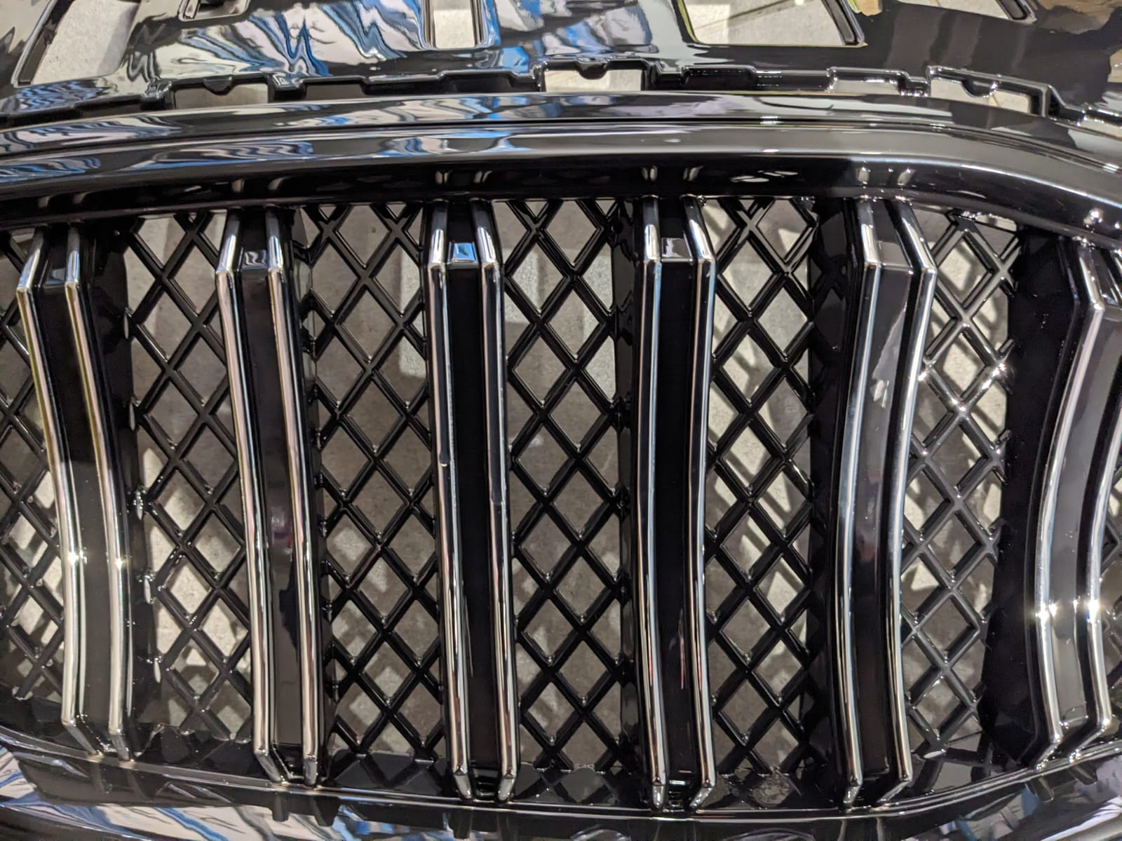 Kia Sportage glossy front grill, designed to add a sleek and premium touch to your vehicle’s front-end appearance.