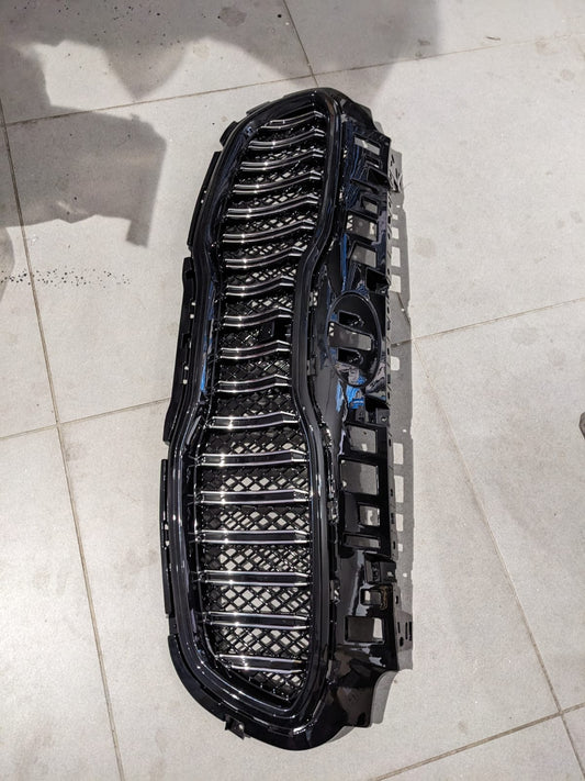 Kia Sportage glossy front grill, designed to add a sleek and premium touch to your vehicle’s front-end appearance.