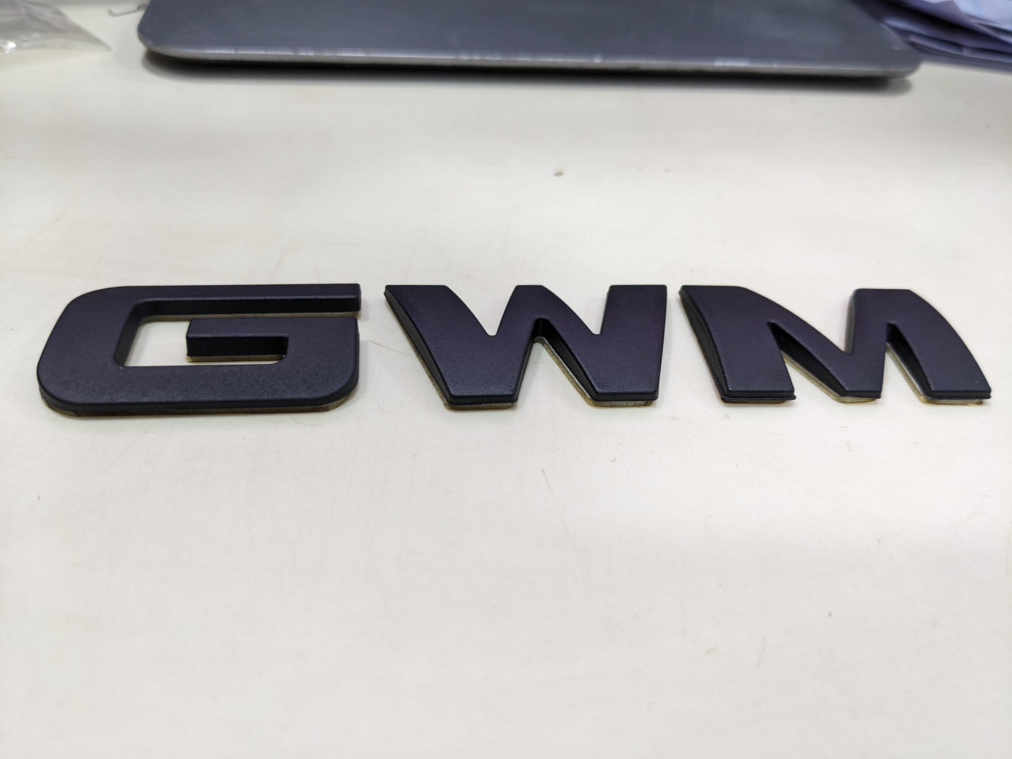 "Matte Black Monogram Emblem for Haval H6 – Front Grille View"