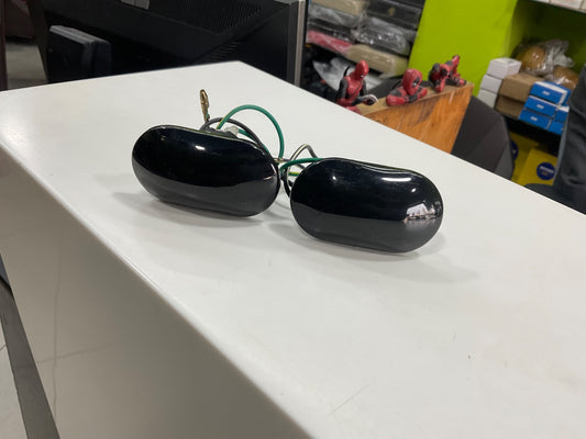 Smoke black fender indicators for Suzuki Mehran, adding a sleek, modern look with enhanced durability and improved turn signal visibility.