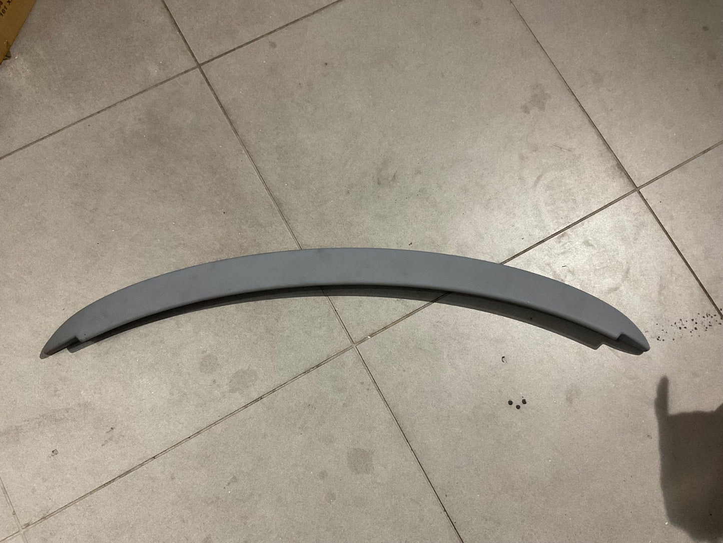 Toyota Vitz ABS plastic roof spoiler with a sleek and sporty design, offering durability and weather resistance.
