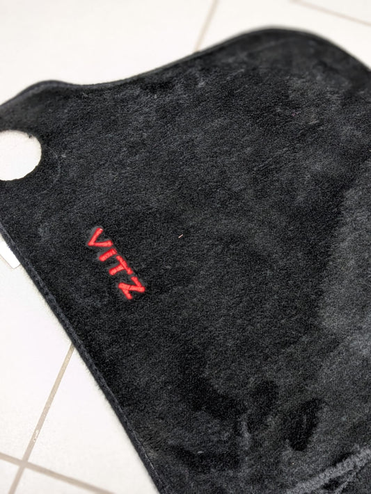 Toyota Vitz dashboard mat providing UV protection and enhancing interior style.