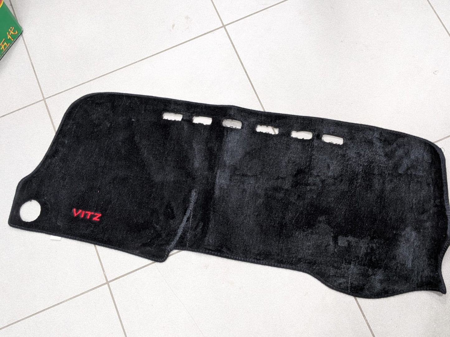 Toyota Vitz dashboard mat providing UV protection and enhancing interior style.