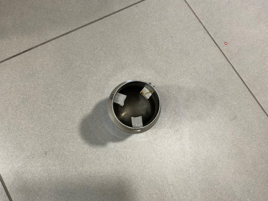 Universal HKS muffler exhaust small silencer tip installed on a car, showcasing a sporty and stylish design.