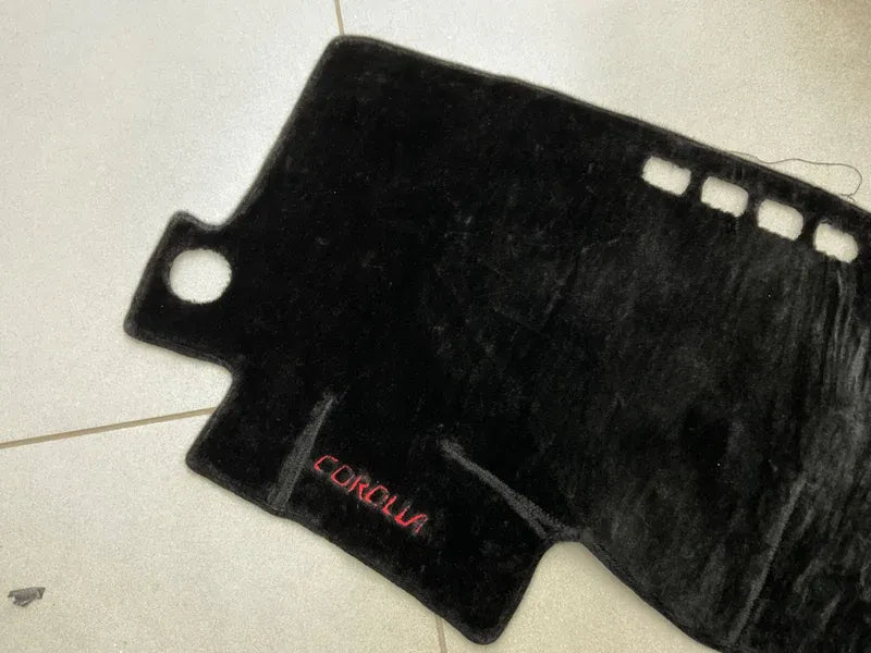 "Custom dashboard carpet mat for Toyota Corolla, offering UV protection, heat resistance, and a stylish interior upgrade."
