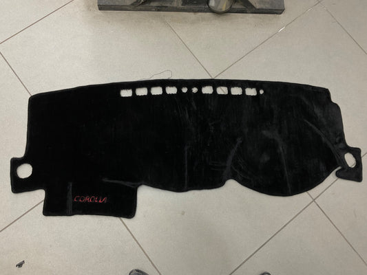 "Custom dashboard carpet mat for Toyota Corolla, offering UV protection, heat resistance, and a stylish interior upgrade."

