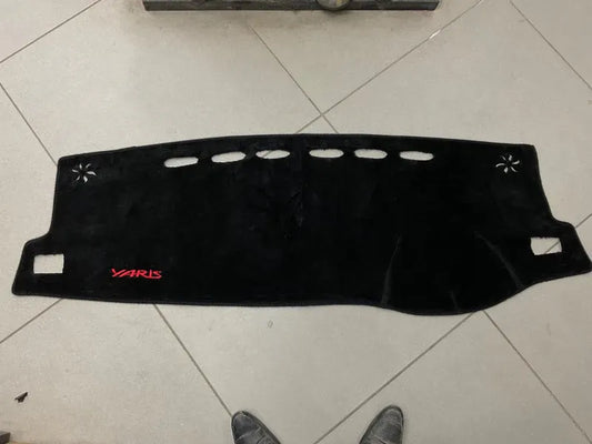 "Custom dashboard carpet mat for Toyota Yaris 2018-2025, offering UV protection, glare reduction, and a sleek interior upgrade."
