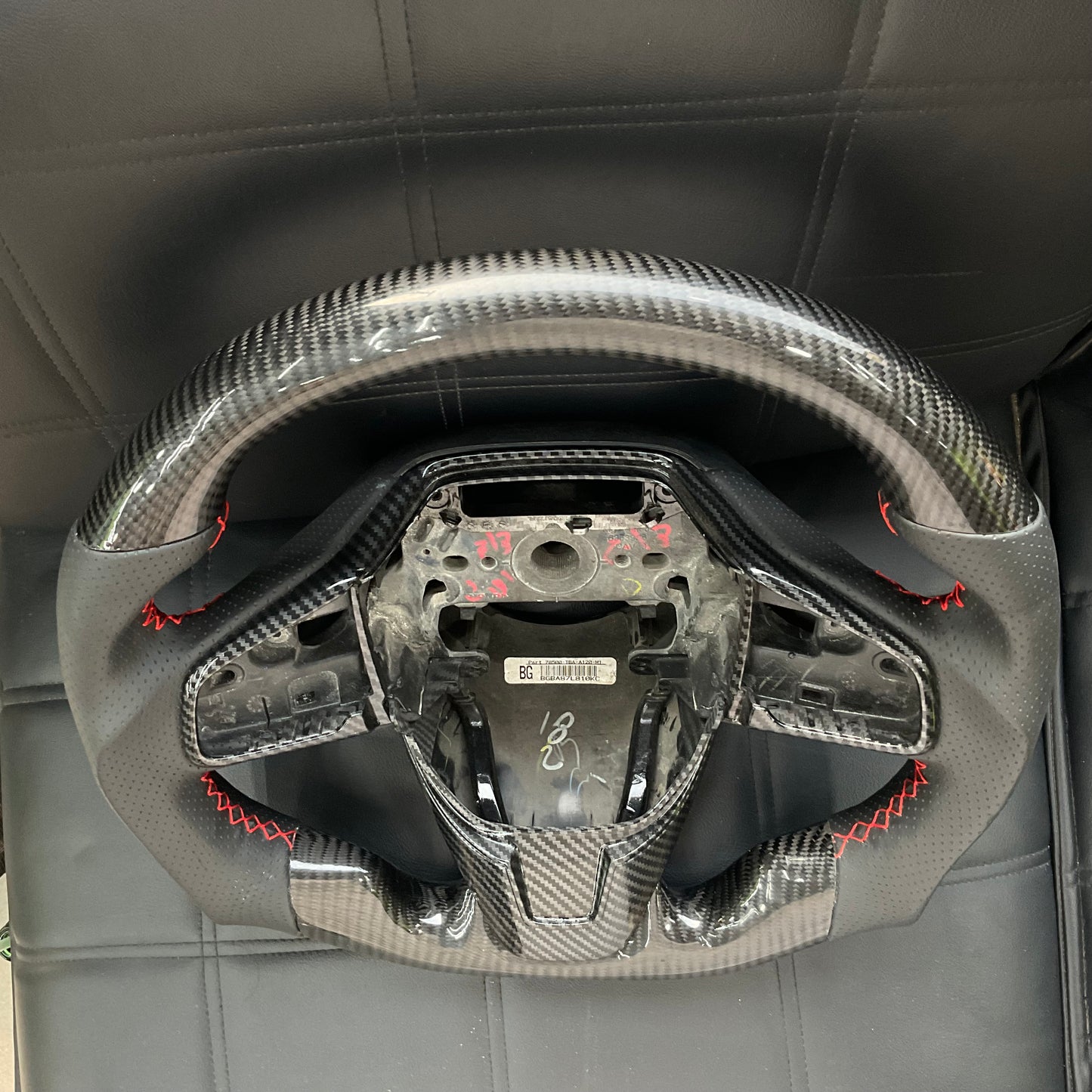Honda Civic 2016-2021 Carbon Fiber Steering Wheel, featuring a premium sporty design, ergonomic grip, and luxurious finish.