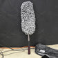 Microfiber car cleaning mop for removing dust from car interior surfaces.