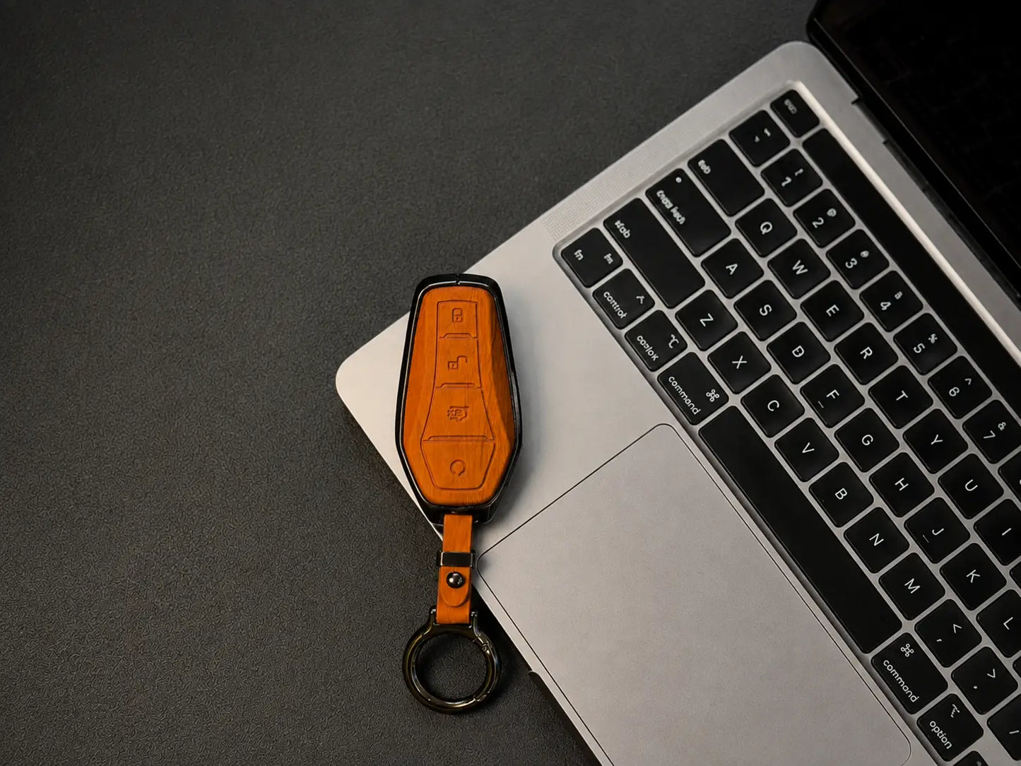 Often includes a matching leather keychain strap with metal rings for a complete set.