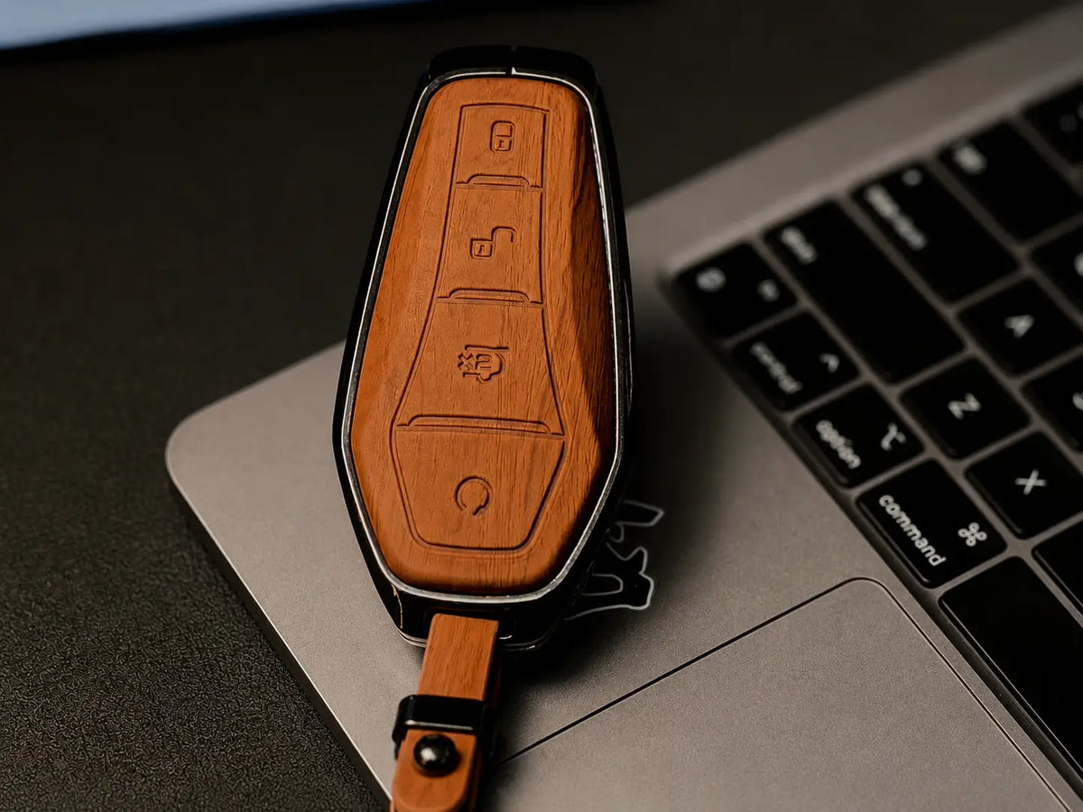 Often includes a matching leather keychain strap with metal rings for a complete set