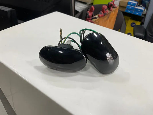 Smoke black fender indicators for Suzuki Mehran, adding a sleek, modern look with enhanced durability and improved turn signal visibility.