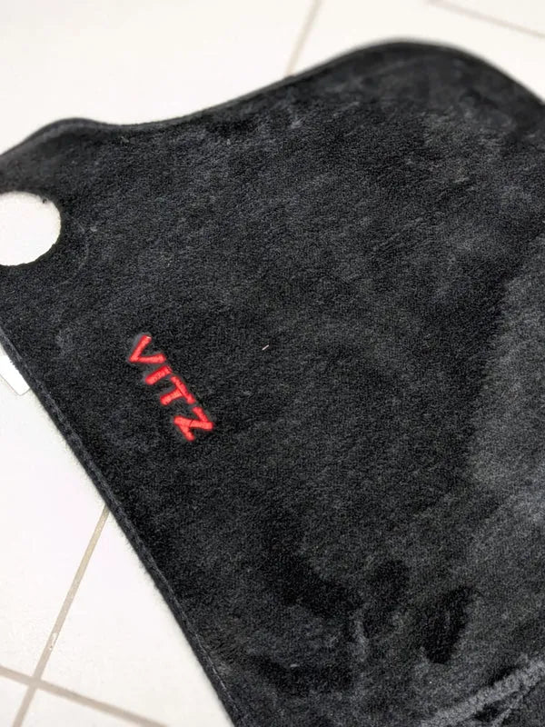 Toyota Vitz dashboard mat providing UV protection and enhancing interior style.
