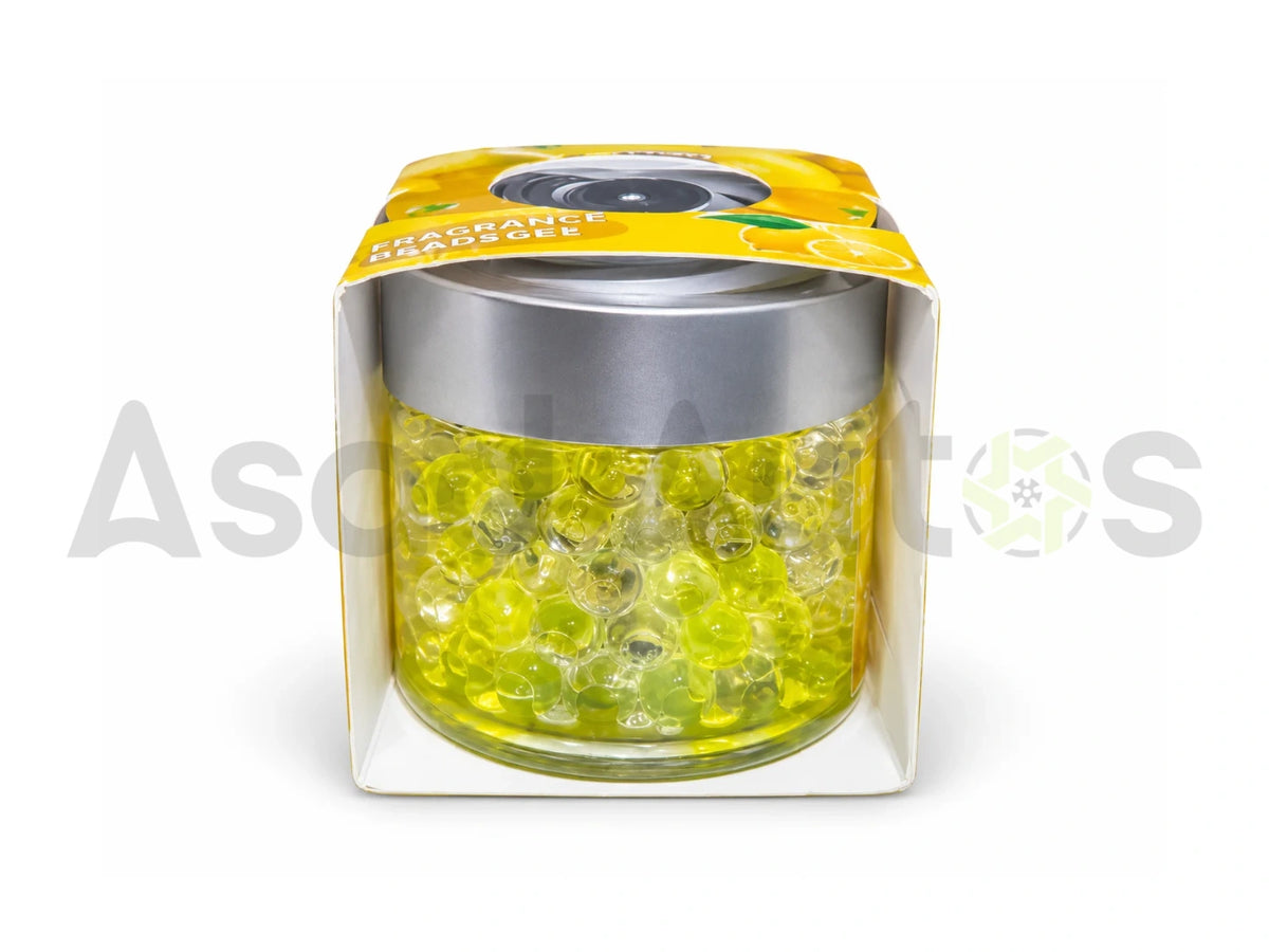 Yellow and transparent gel fragrance beads in a clear air freshener jar with silver lid