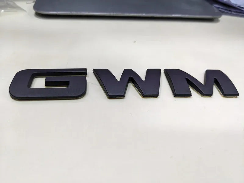 "Matte Black Monogram Emblem for Haval H6 – Front Grille View"
