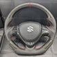 "Carbon Fiber Steering Wheel with Spiral for Suzuki Alto – Premium Grip, Sporty Look, and Durable Design."
