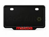 Raptic number plate frame installed on a Mazda bumper